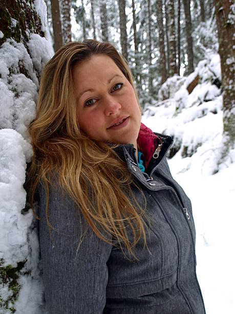 istock Female hiker enjoying a snowy forest walk 645289700