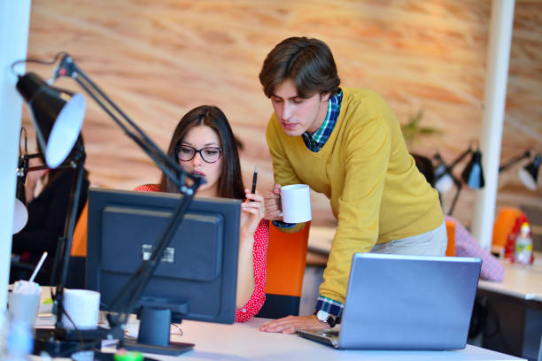 istock business couple working together on project at modern startup office 645289710