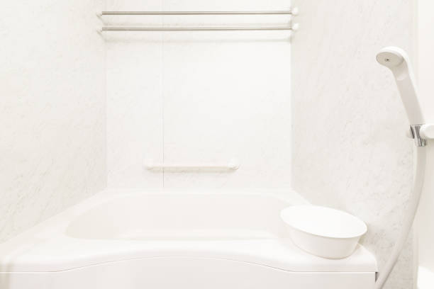 istock White bathtub and shower at clean bathroom 645313002