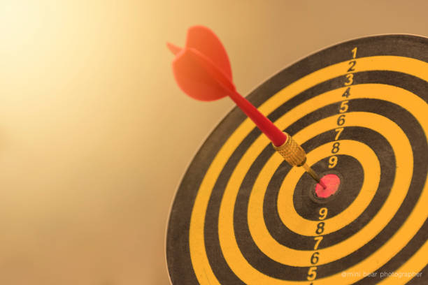 istock Red dart arrow with over blurred background. target of dartboard 645322622