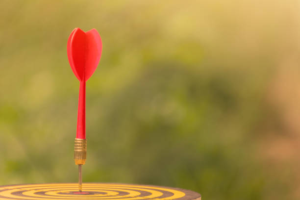 istock Red dart arrow with over blurred green background 645324986