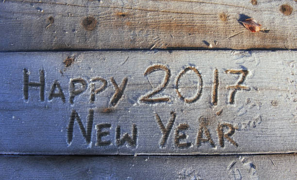istock Writing on the snow. Wooden texture. 645325246