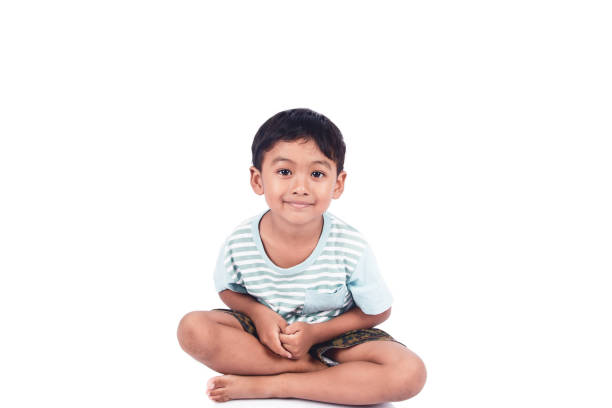 istock cute little boy smile and sitting on floor 645327866