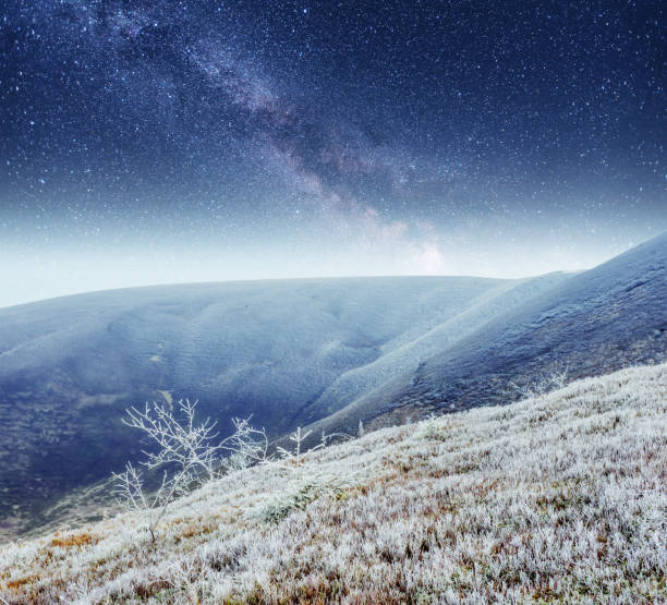 istock fantastic winter meteor shower and the snow-capped mountains 645330912