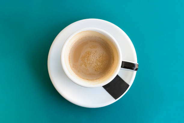 istock Cup of coffee on turquoise with copyspace 645337772