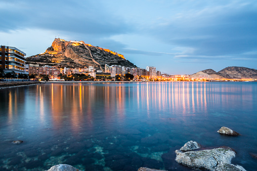 View of Alicante at dusk from the sea, Costa Blanca, Valencia province. Spain.