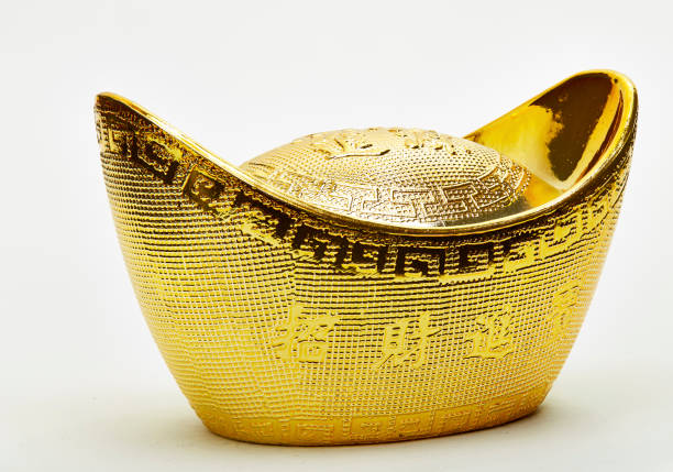 istock chinese gold ingots isolated on white background 645343574
