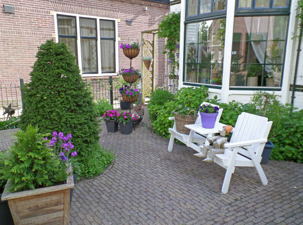 istock White bench at the relaxing corner on the front yard 645347062