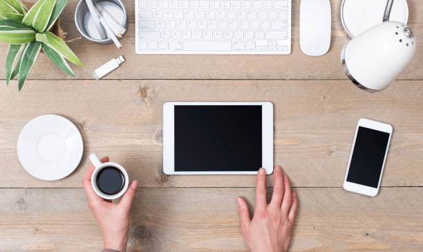 istock top view women office desk 645353770