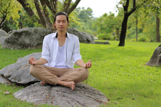 istock Young yogi man doing yoga meditation 645353932