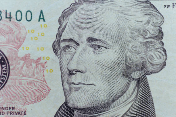 istock Alexander Hamilton face on US ten or 10 dollars bill macro, unit 645360446