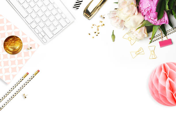 istock Flower on the table. Keyboard and stapler. Home workplace. Table view. Business accessories. Mock-up background.Peonies 645369814