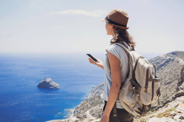 istock Young woman on vacations using smart phone 645374604