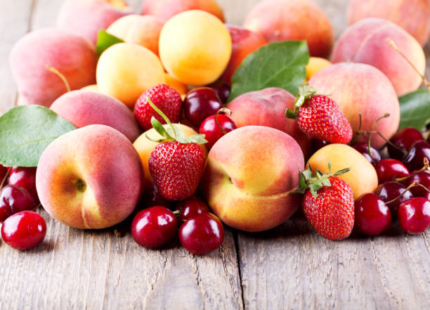 istock fresh fruits on wooden table 645374814