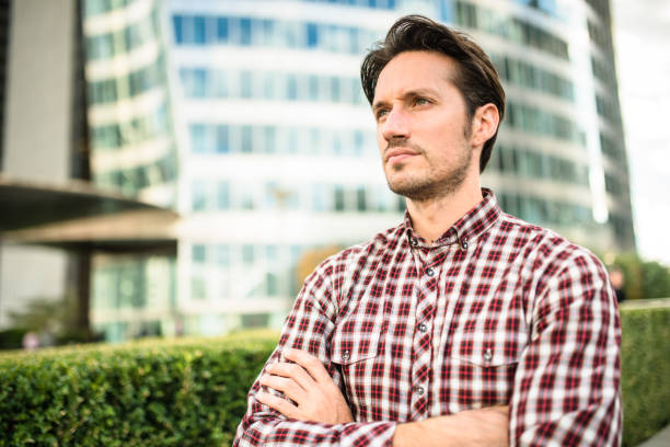 istock casual businessman with arm crossed 645384154