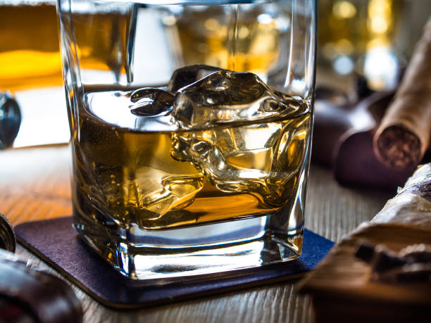 istock Whiskey on the rocks on a wooden table 645387266