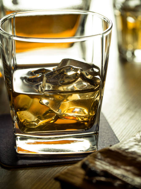 istock Whiskey on the rocks on a wooden table 645387404
