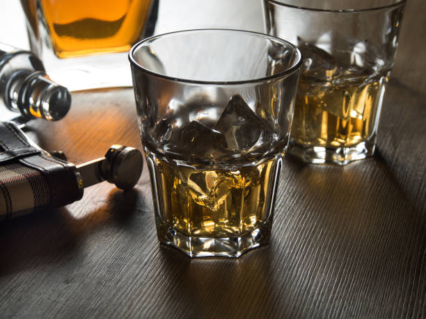 istock Whiskey on the rocks on a wooden table 645387430