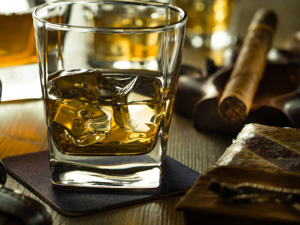 istock Whiskey on the rocks on a wooden table 645387478