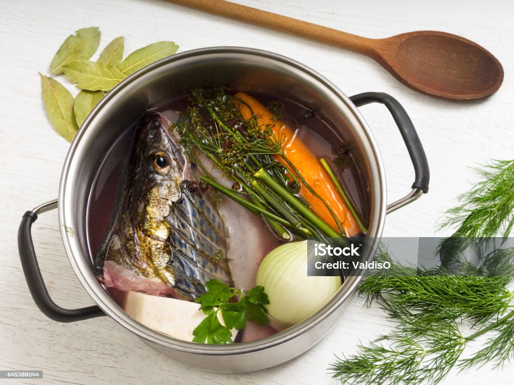 Perch stock in a steel pot Broth Stock Photo