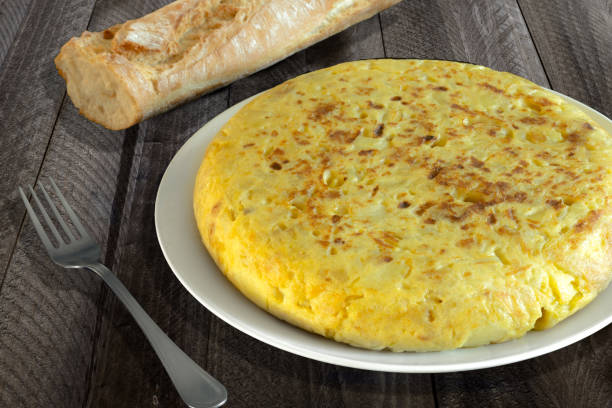 istock Homemade spanish omelette on wooden table 645390398