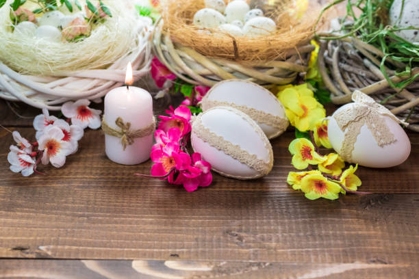 istock Beautiful Easter eggs with flowers on the wooden background 645390658