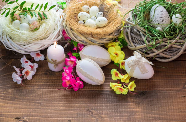 istock Beautiful Easter eggs with flowers on the wooden background 645390700