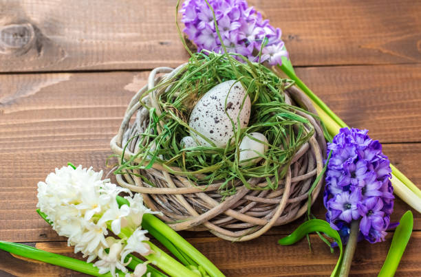 istock Beautiful Easter eggs with flowers hyacinths on the wooden background 645390800