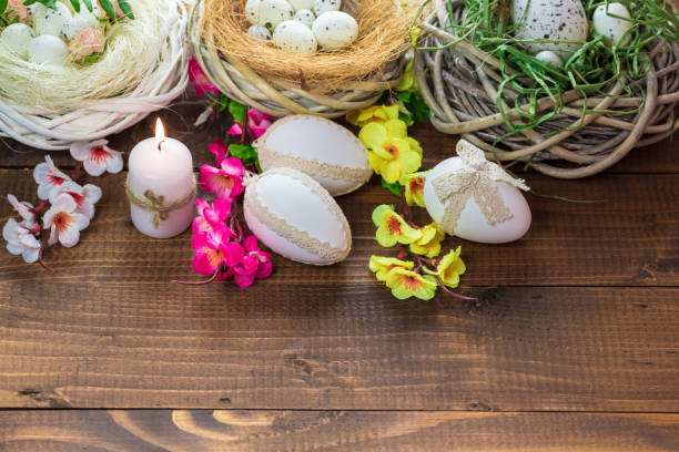 istock Beautiful Easter eggs with flowers on the wooden background 645390832