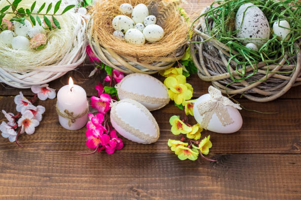 istock Beautiful Easter eggs with flowers on the wooden background 645390884