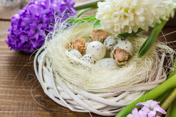 istock Beautiful Easter eggs with flowers hyacinths on the wooden background 645390908