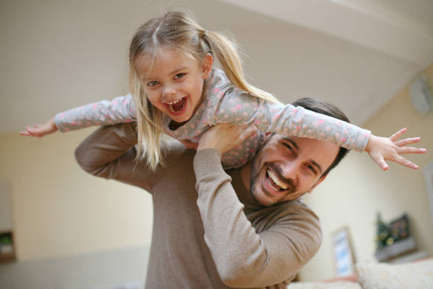 istock Young dad with cute daughter at home. 645394650