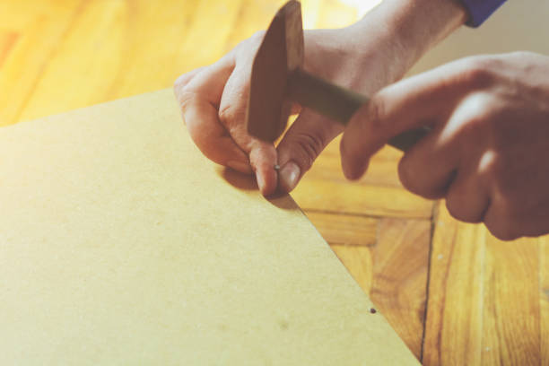 istock Male Hand With Hammer 645394740