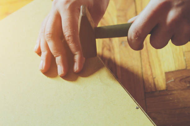 istock Male Hand With Hammer 645394756