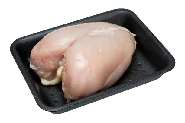 istock Fresh raw chicken breast with bones in the standard plastic black container. Isolated with patch 645397504