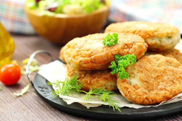 istock Chicken cutlets with vegetables and herbs 645400564