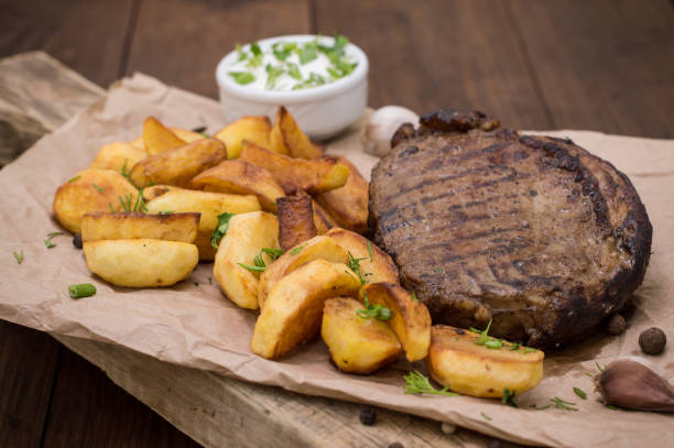 istock Rustic grilled beefsteak with french fries 645401208