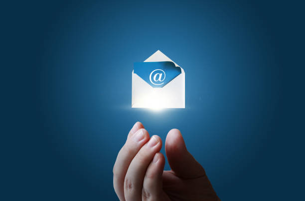 In businessman hand the envelope with the electronic message .