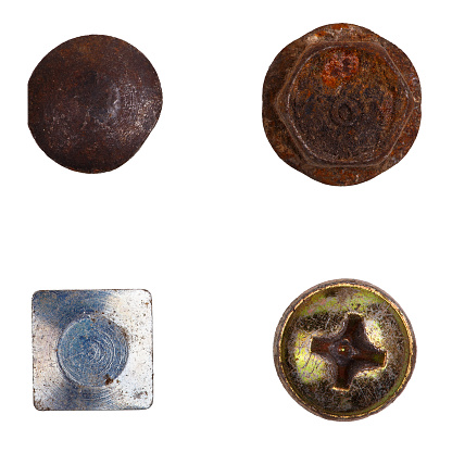 Four different bolt heads: rusty, silver, golden isolated white background