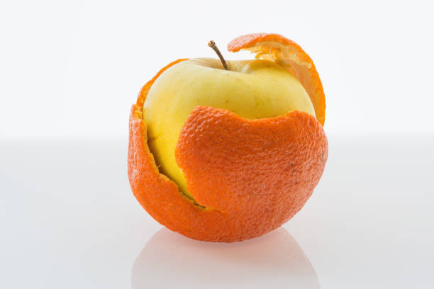 istock Apple in a tangerine peel 645412584
