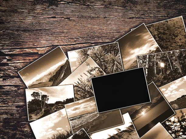 istock old vintage photos on a wooden background 645416450
