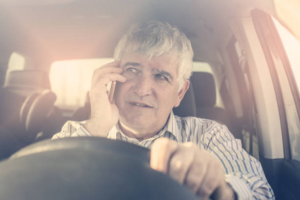 istock Businessman using a phone, sitting in car. 645422328