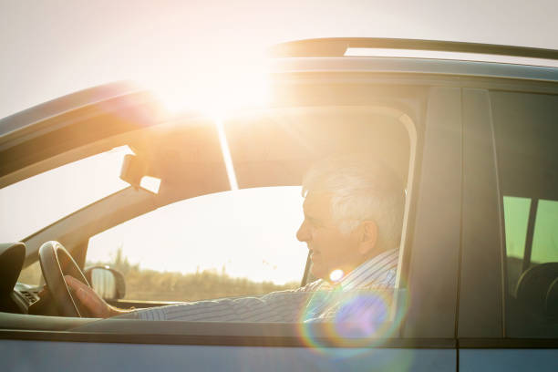 istock Senior man driving a car. 645422526