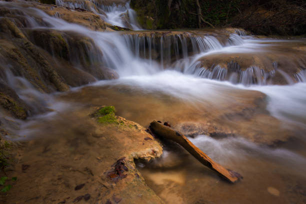 istock Pristine waterfalls deep in the woods, on a bright sunny day in spring 645422670