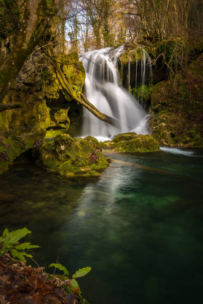 istock Pristine waterfalls deep in the woods, on a bright sunny day in spring 645422884
