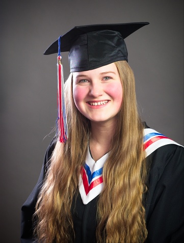 High school graduation portrait of a teenage blonde girl.