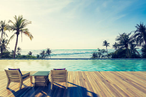 Beautiful view of Swimming Pool with  the sea at sunlight ,Vintage Tone - 3d rendering