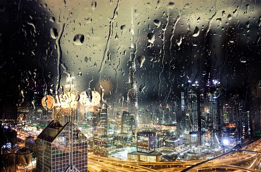 A rare view of the Dubai Skyline including the famous Burj Khalifa in a raining day.
