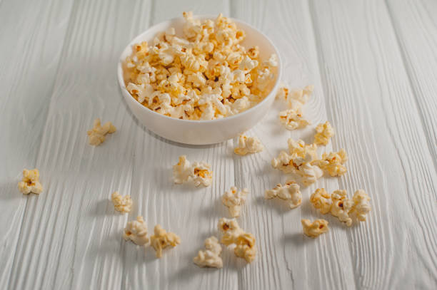 istock popcorn on a white wooden background 645439726
