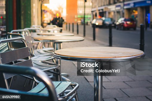istock Cafe furniture on pavement 645439980